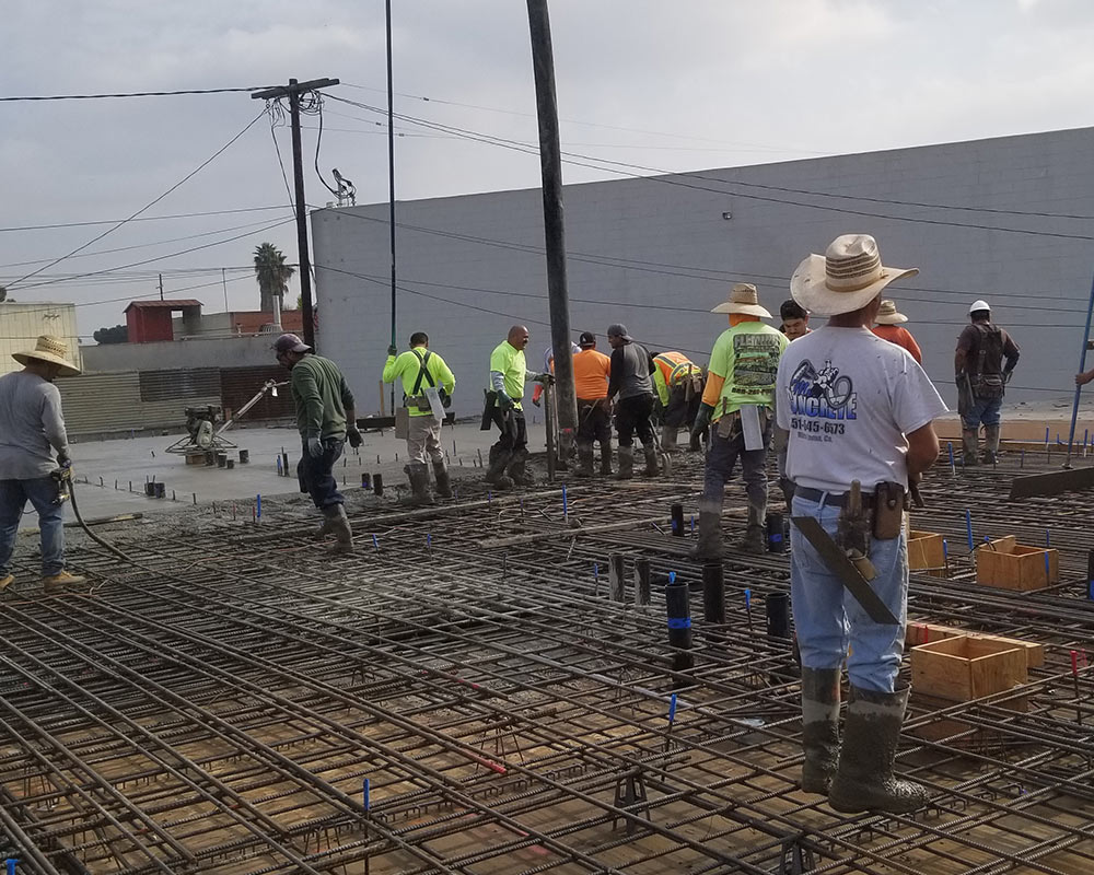 construction company contractors installing concrete surface at property exteriors port hueneme ca