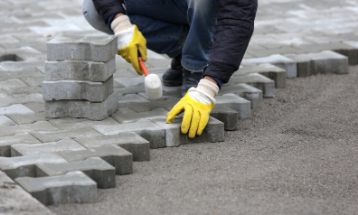 Paving stone worker putting down pavers port hueneme ca