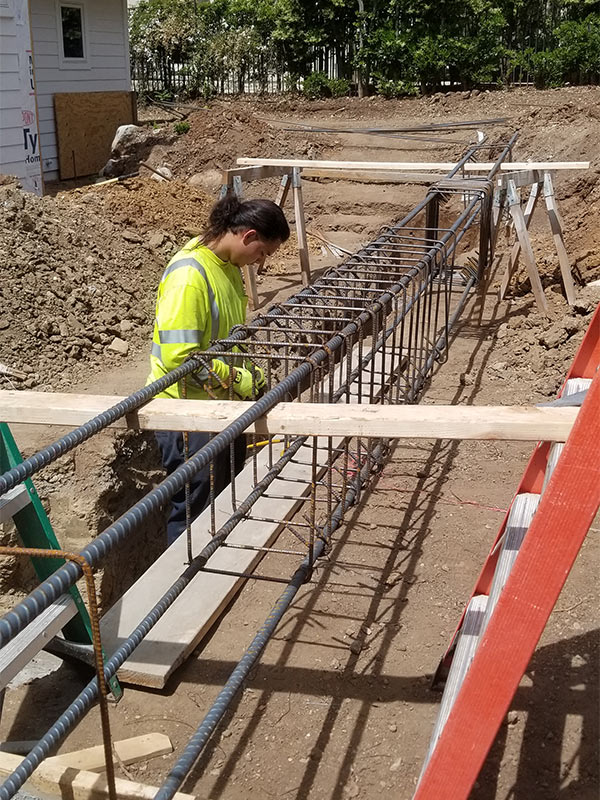 contractor close up working on new construction house foundation port hueneme ca