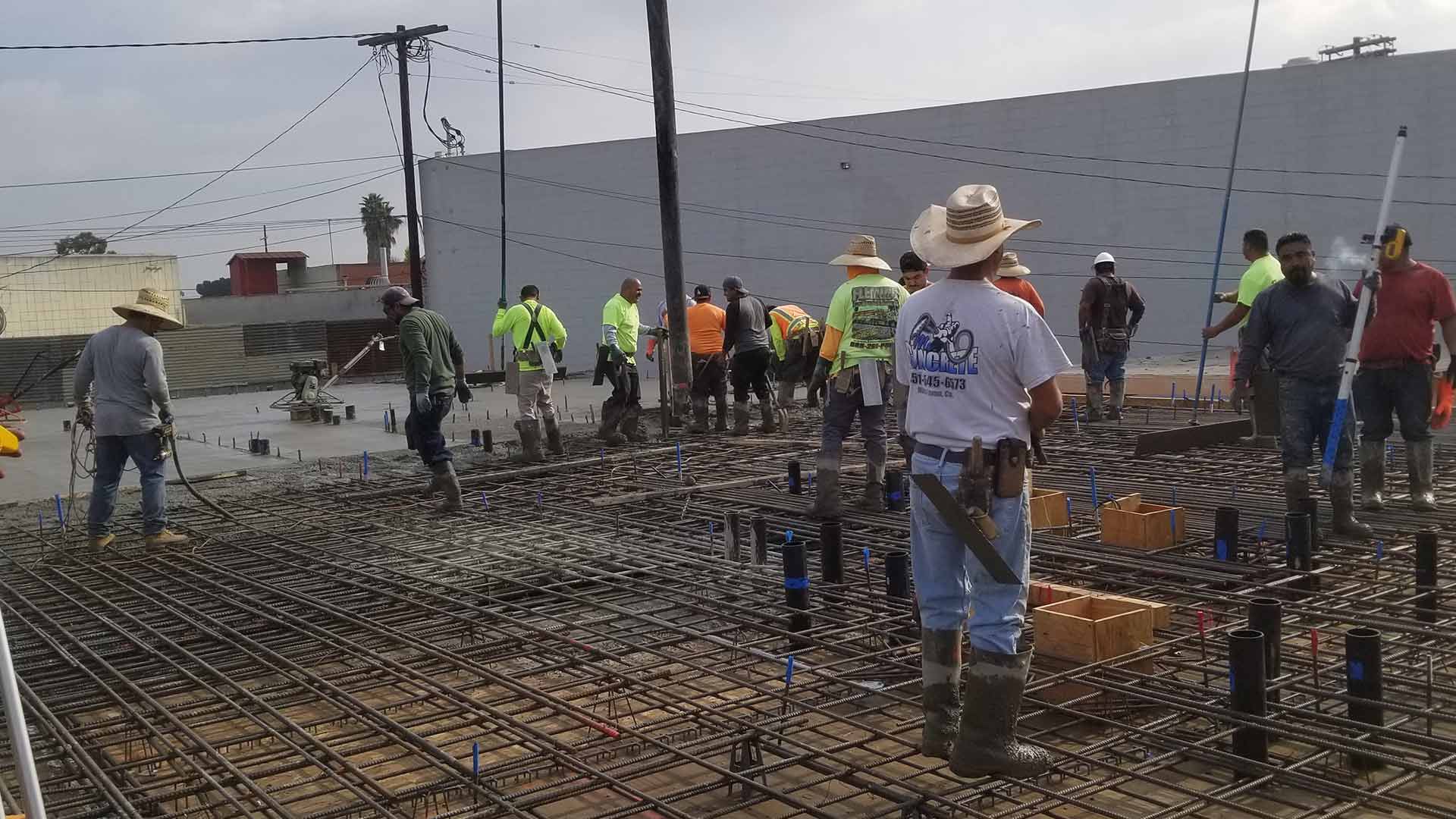 group of contractors installing new concrete surface at property exteriors port hueneme ca